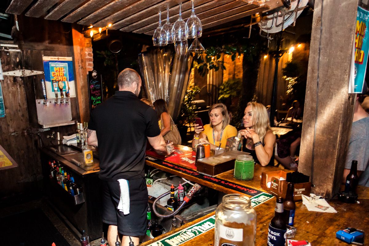 Seville Quarter - Bartender Serves Drinks at End O the Alley