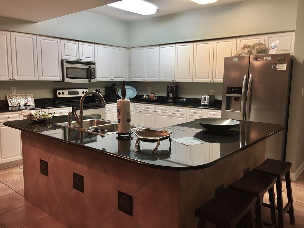 Fully Stocked Stainless Kitchen with Breakfast Bar