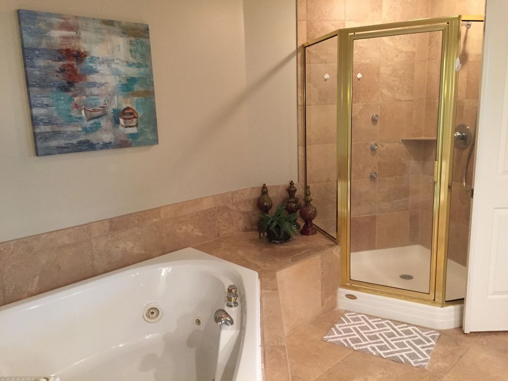 Mastr Bath with Glass Enclosed shower and Jacuzzi Tub