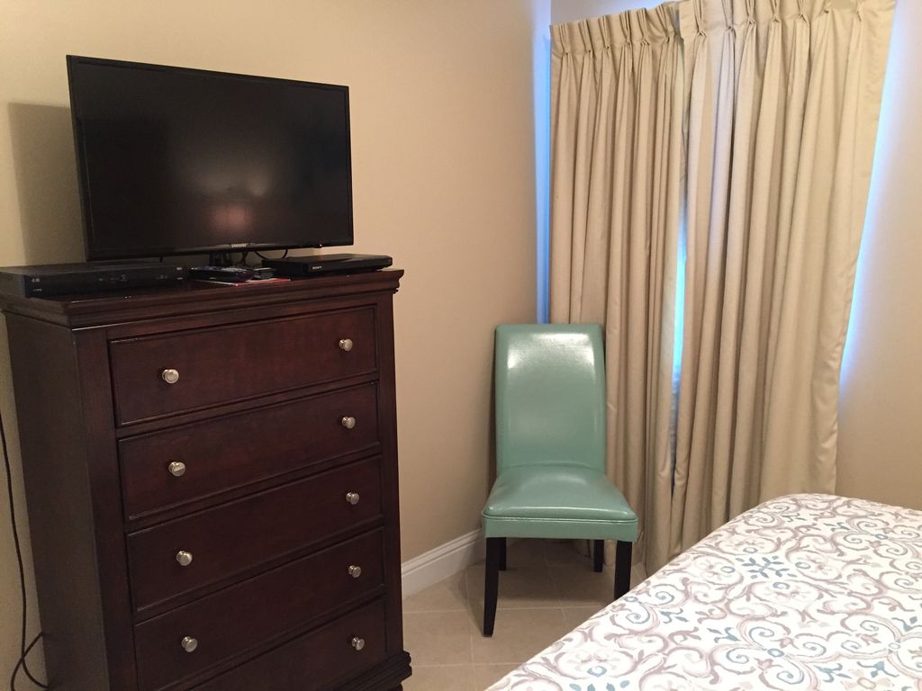 Guest Bedroom with Large HDTV and DVD