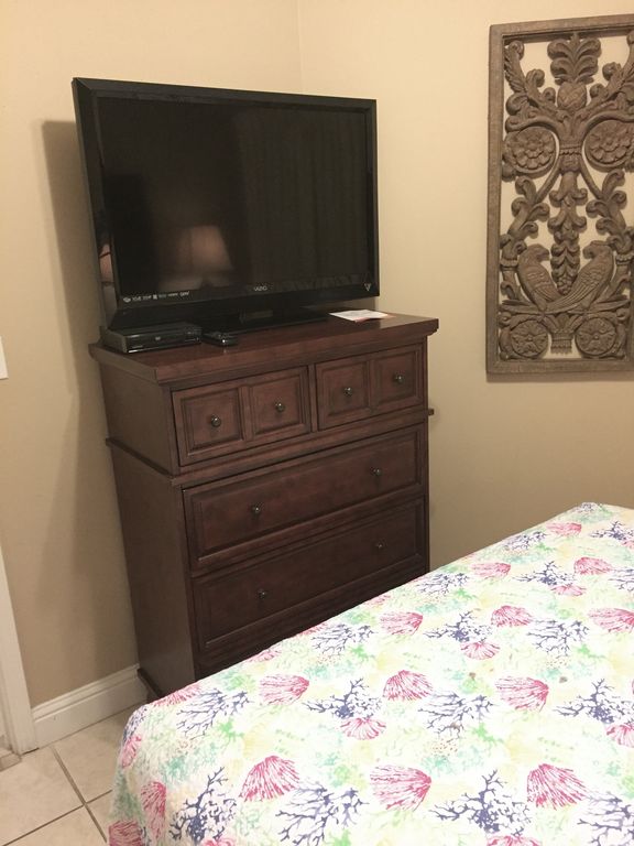 Guest Bedroom with Large HDTV and DVD