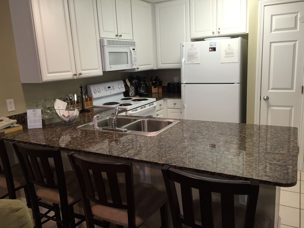 Fully Stocked Kitchen and Breakfast Bar with Seating for 4