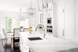 image of a kitchen with white countertops and cabinets