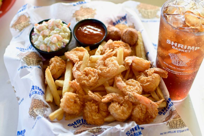 Basket with fried shrimp and french fries