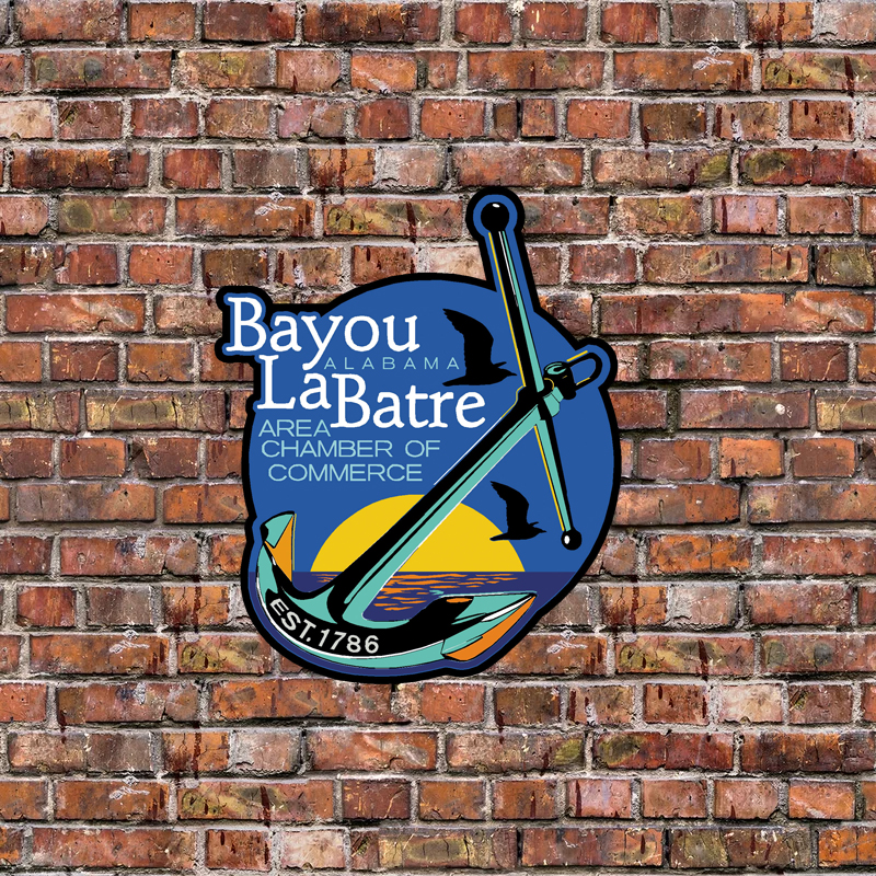 brick wall with chamber logo centered on wall