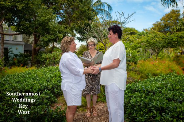 Wedding officiant performs an elopement ceremony at the Truman Annex Pocket Garden
