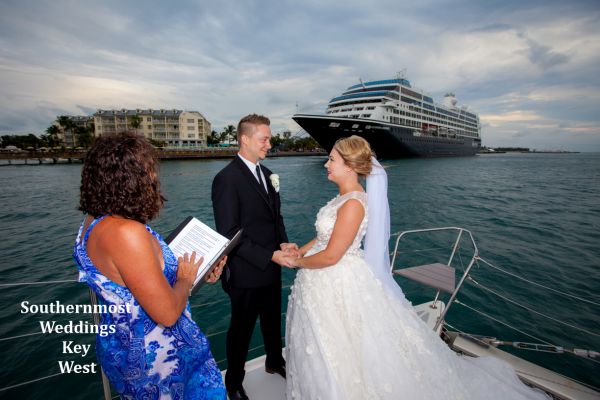 Wedding couple getting married on their private sunset sail off the coast of Key West, Florida