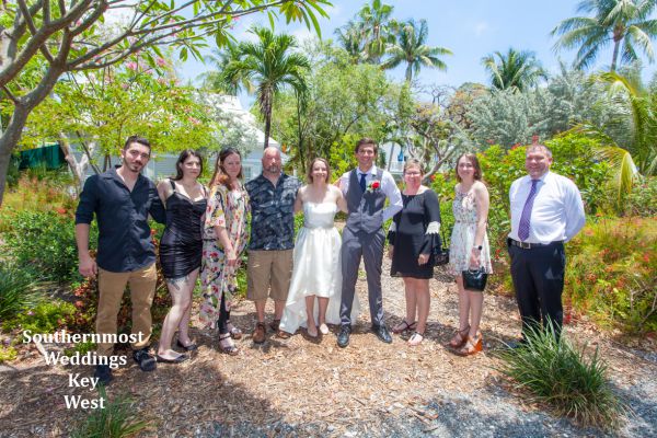 Wedding party pose for photos after their Truman Annex Tropical Garden Wedding by Southernmost Weddings