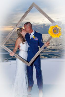Wedding Couple poses for photos after the wedding on a spacious catamaran