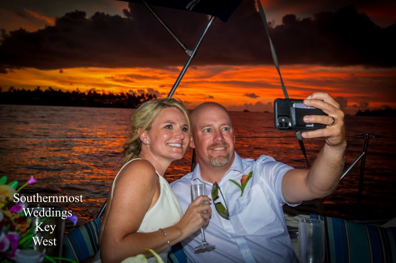 Southernmost Weddings photo editing department editing a batch of images