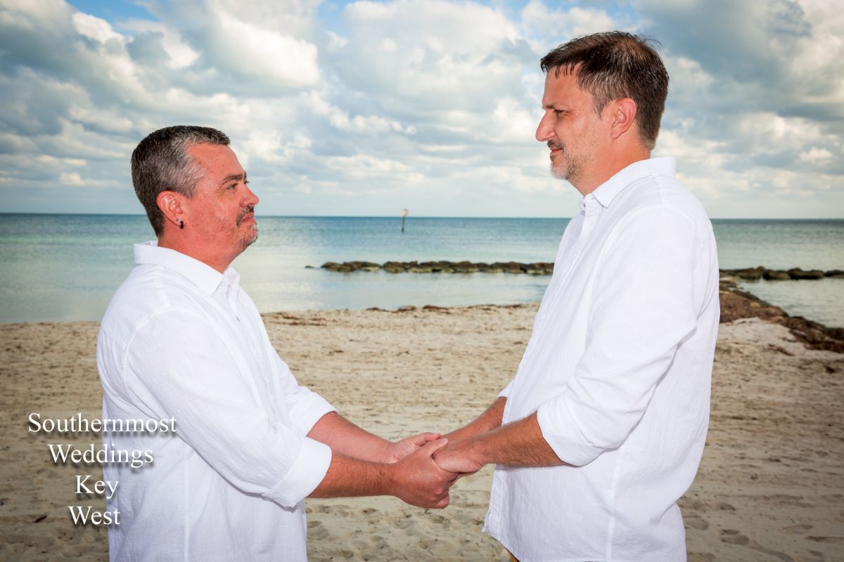 Two men get married by Southernmost Weddings on Smathers Beach in Key West, Florida