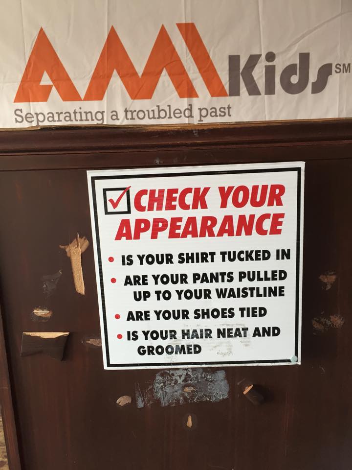 A sign that says check your appearance 