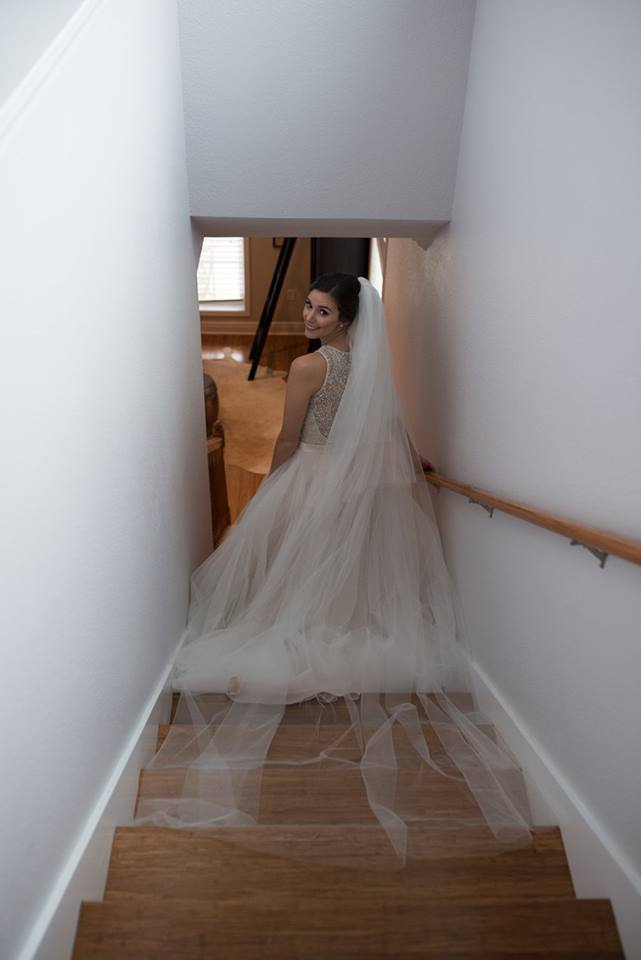 Bride walking down stairs