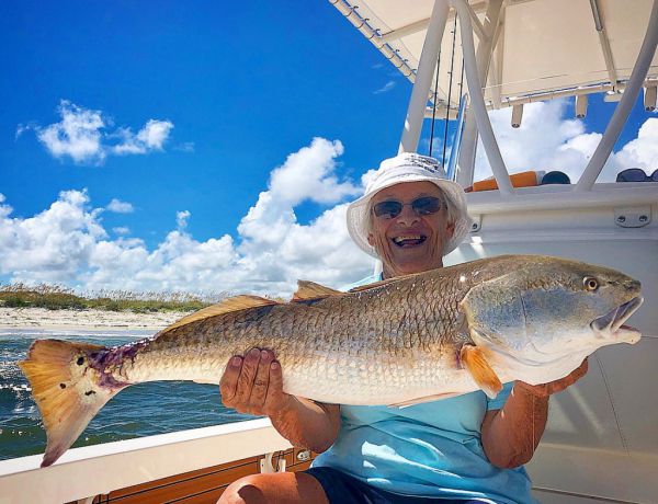 Picture of Man Holding Redfish