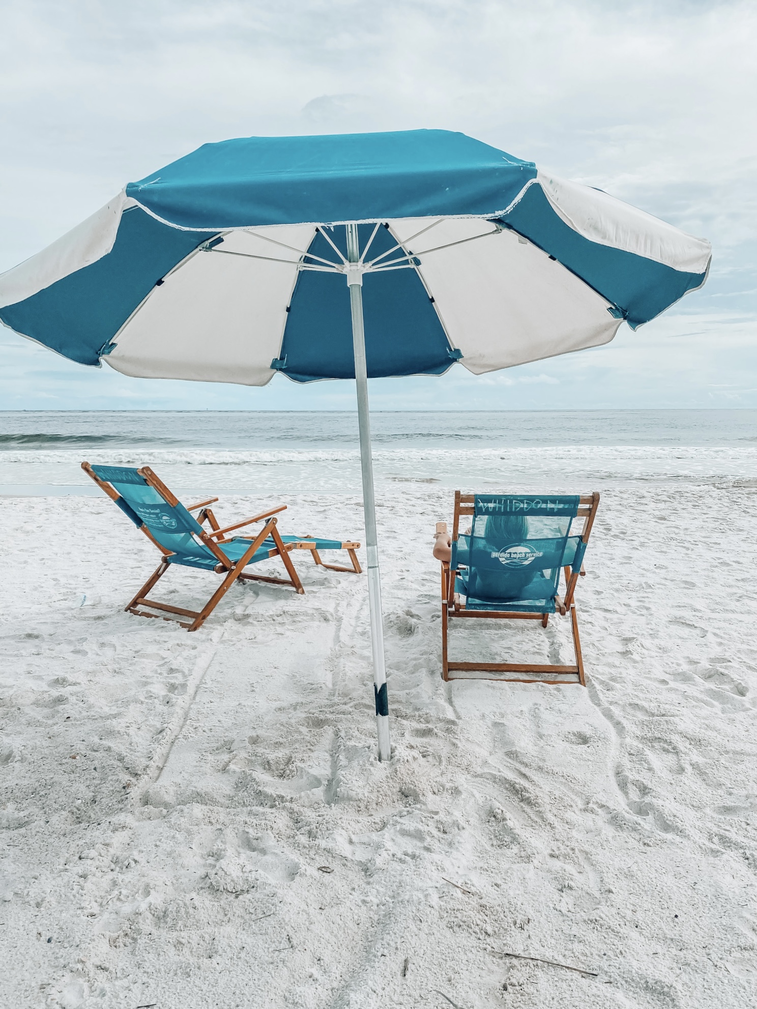 beach chairs with umbrellas