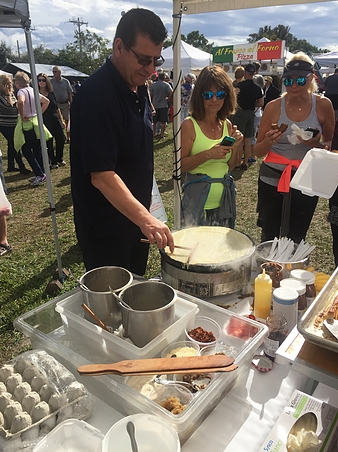 Chef Denis Meurgue deep frying crepes at the Farmer's Market