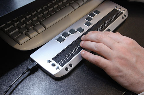 image of person using assistive keyboard technology