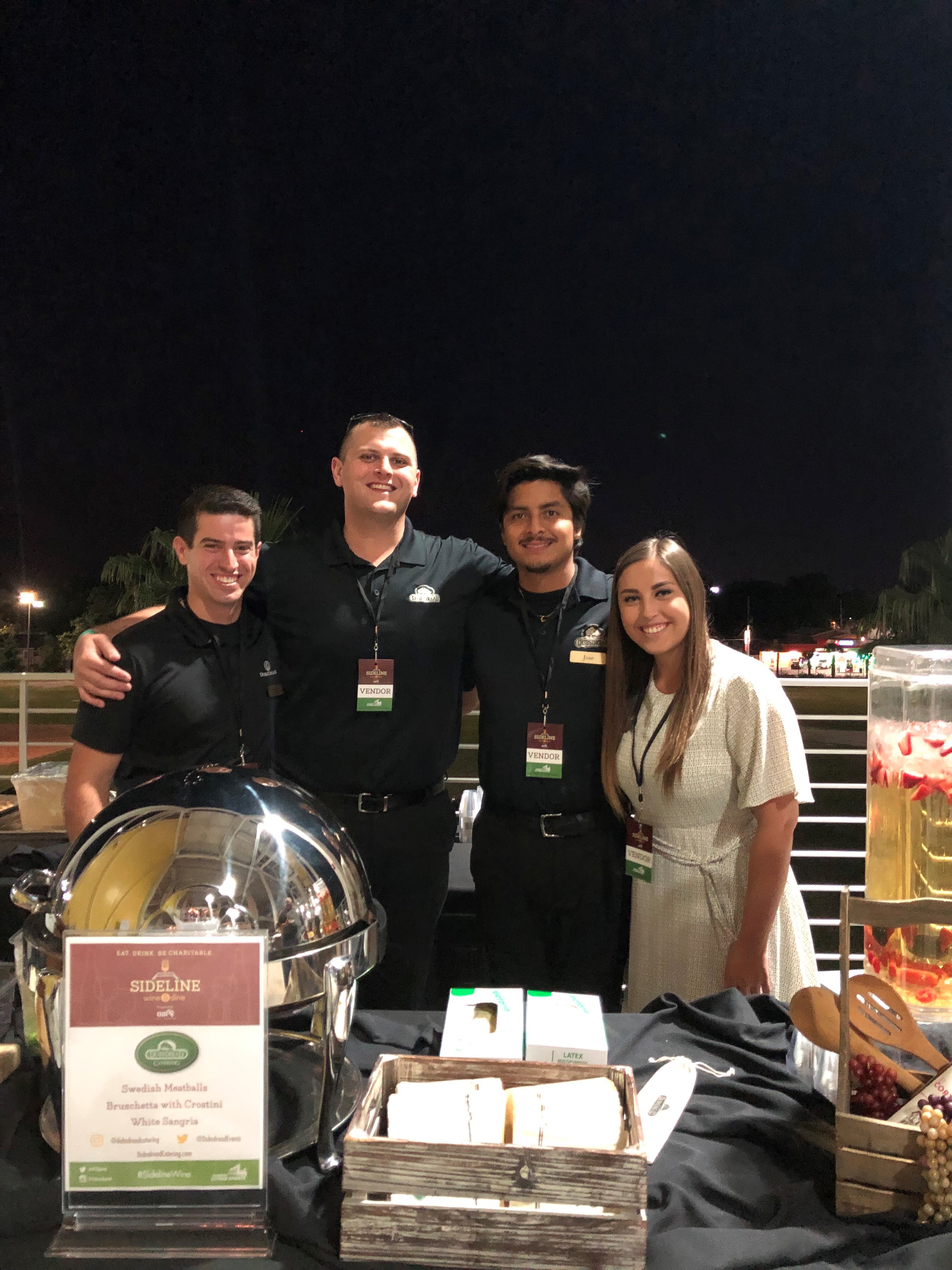 dubsdread catering crew posing at sideline wine and dine