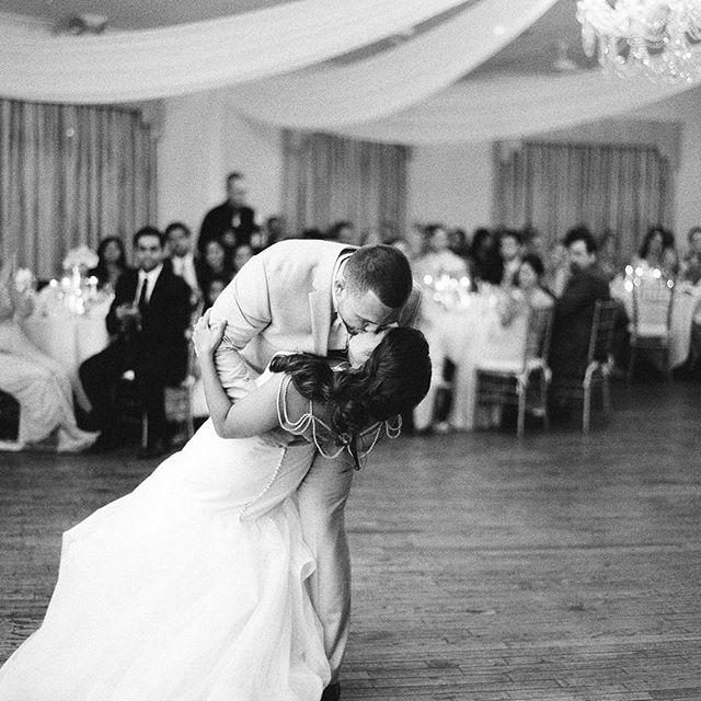 bride and groom kiss on the dance floor