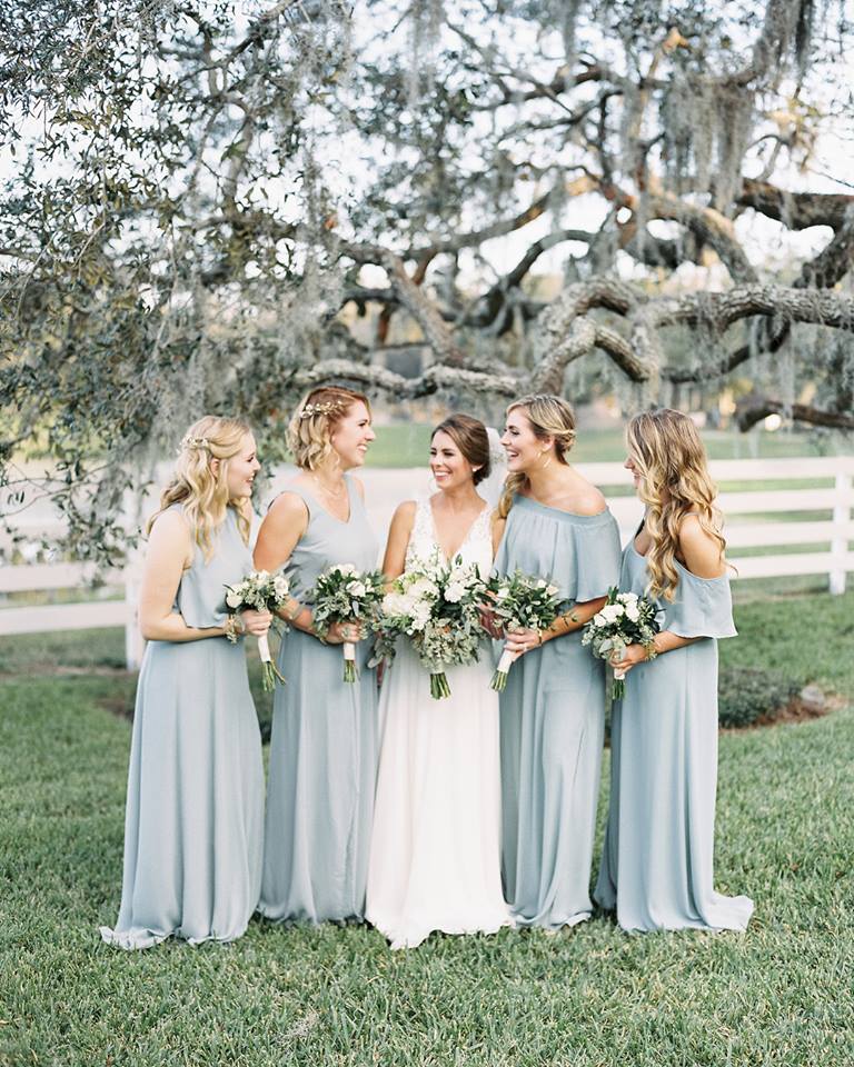 bride and bridesmaid holding bouquets