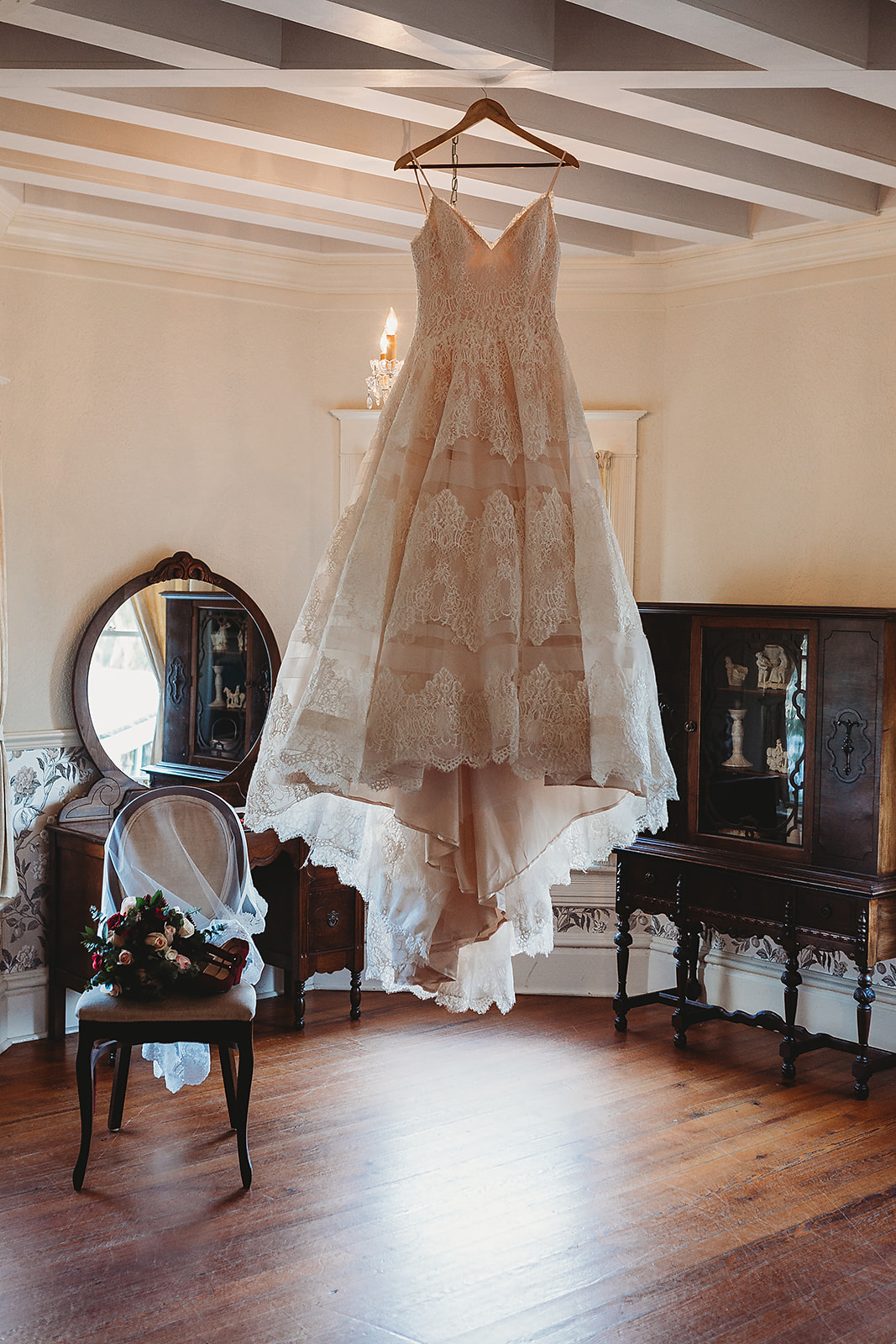 wedding dress hanging in bridal suite