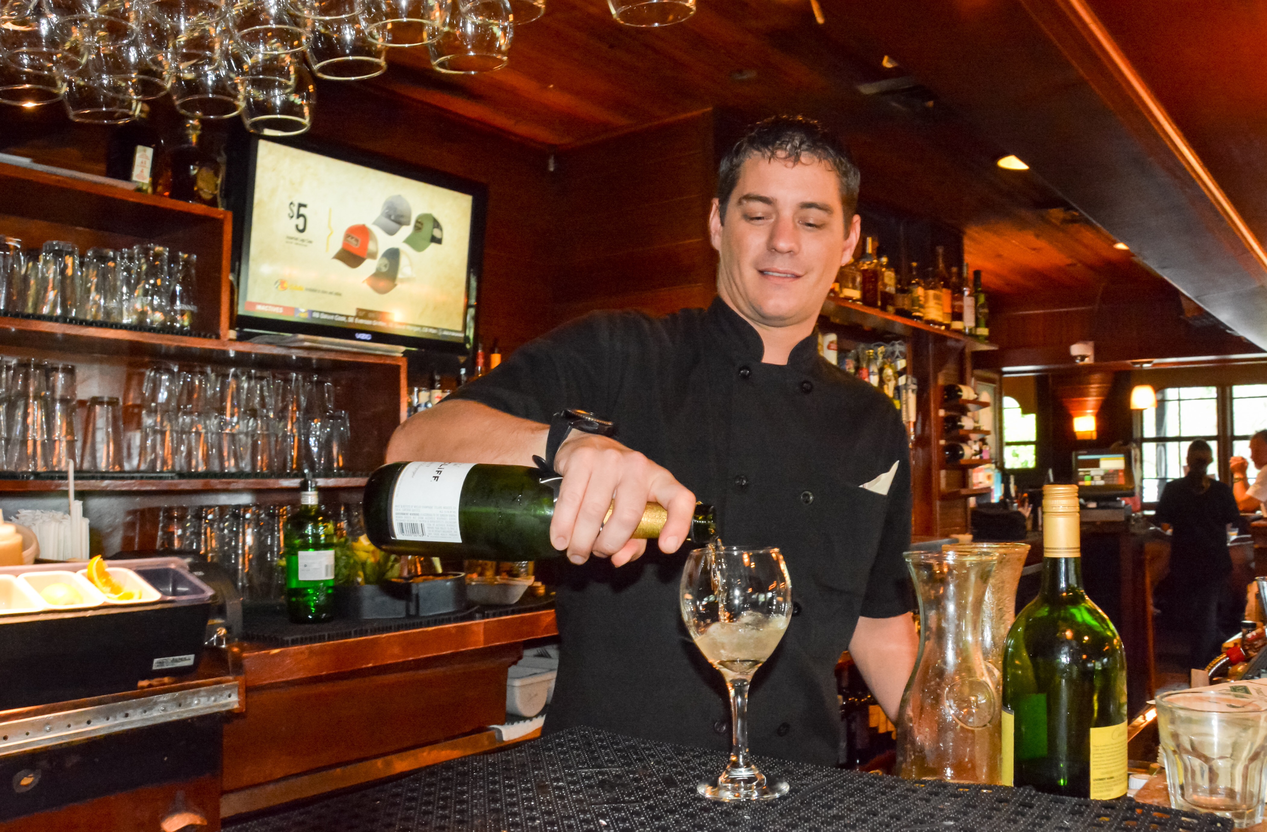 Bartender pouring champagne