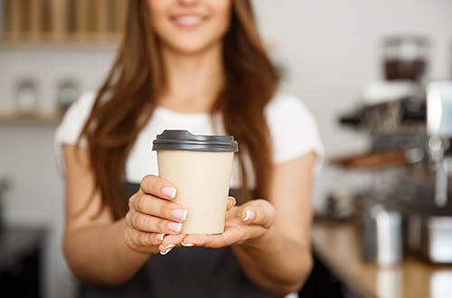 Girl holding a coffee
