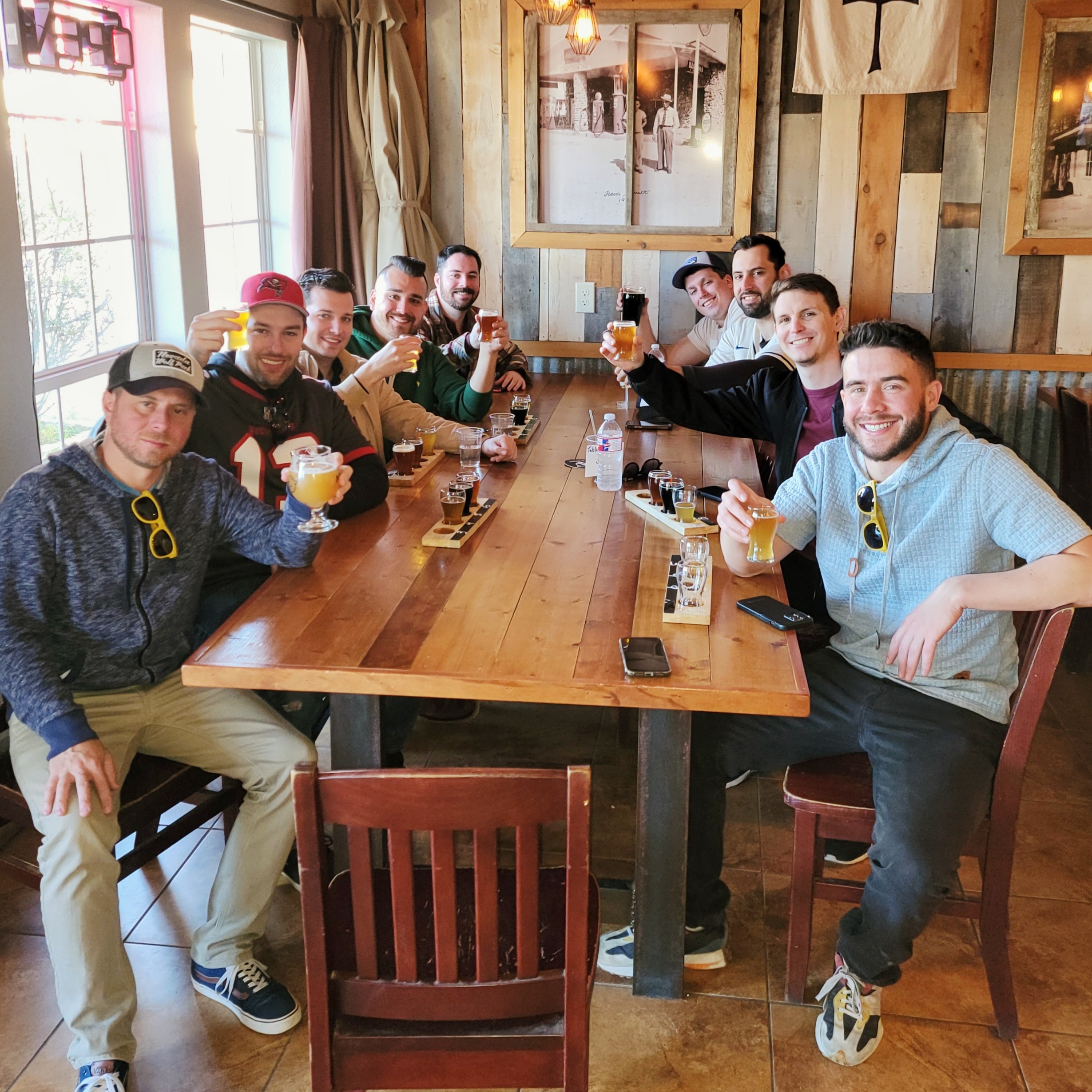 brewery tour guests drinking beer in taproom