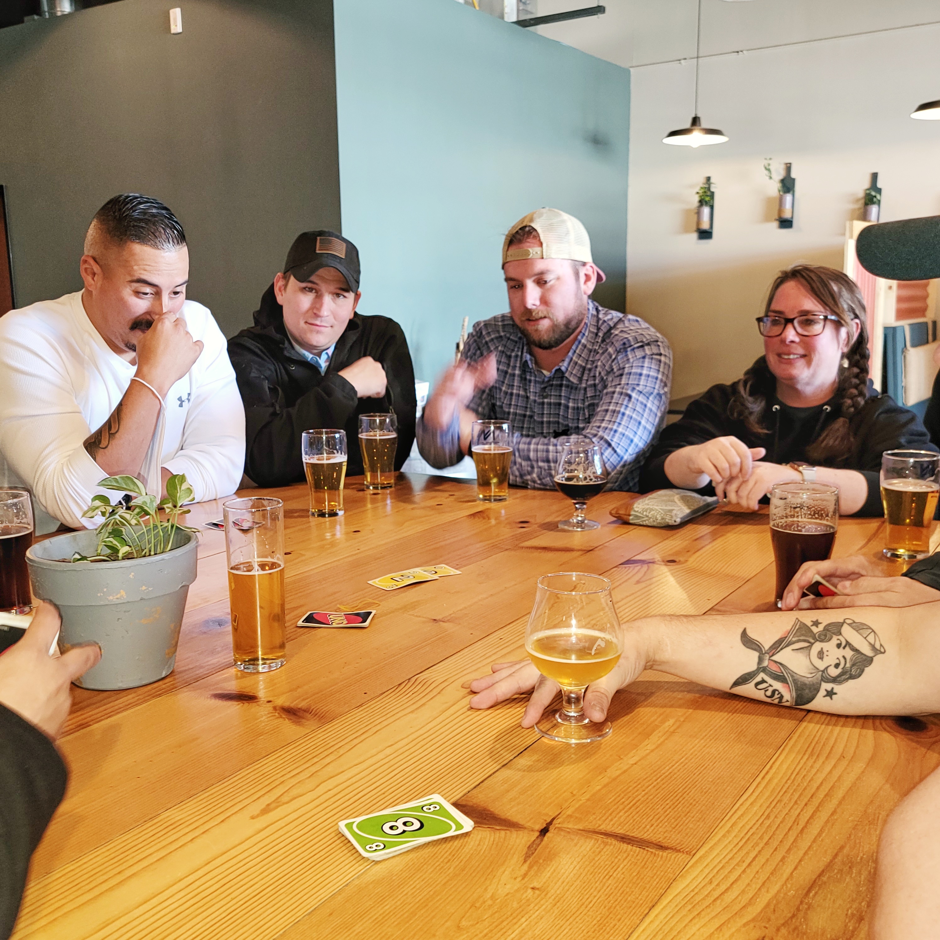 People playing cards at brewery