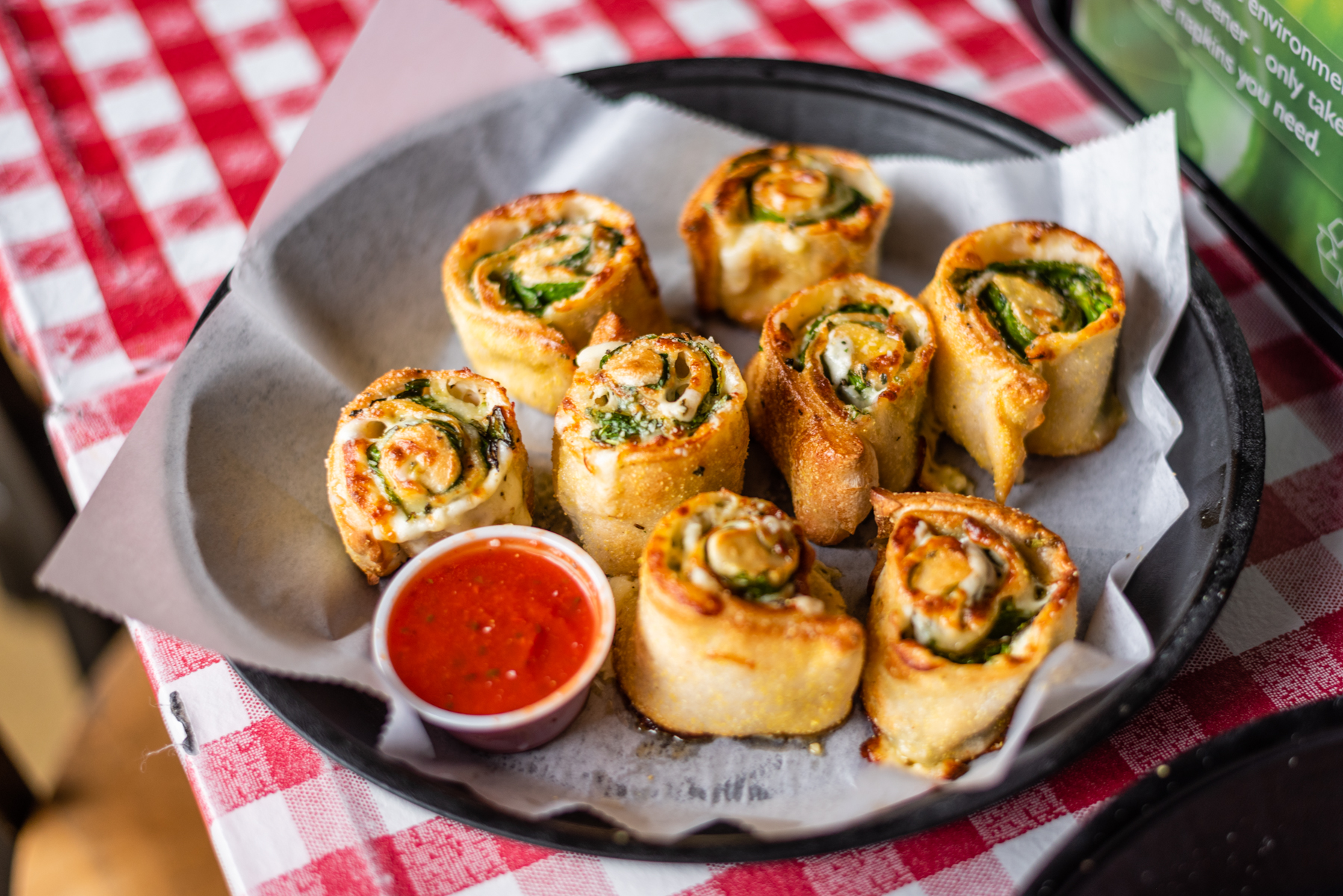 Pizza pinwheels with fresh spinach image