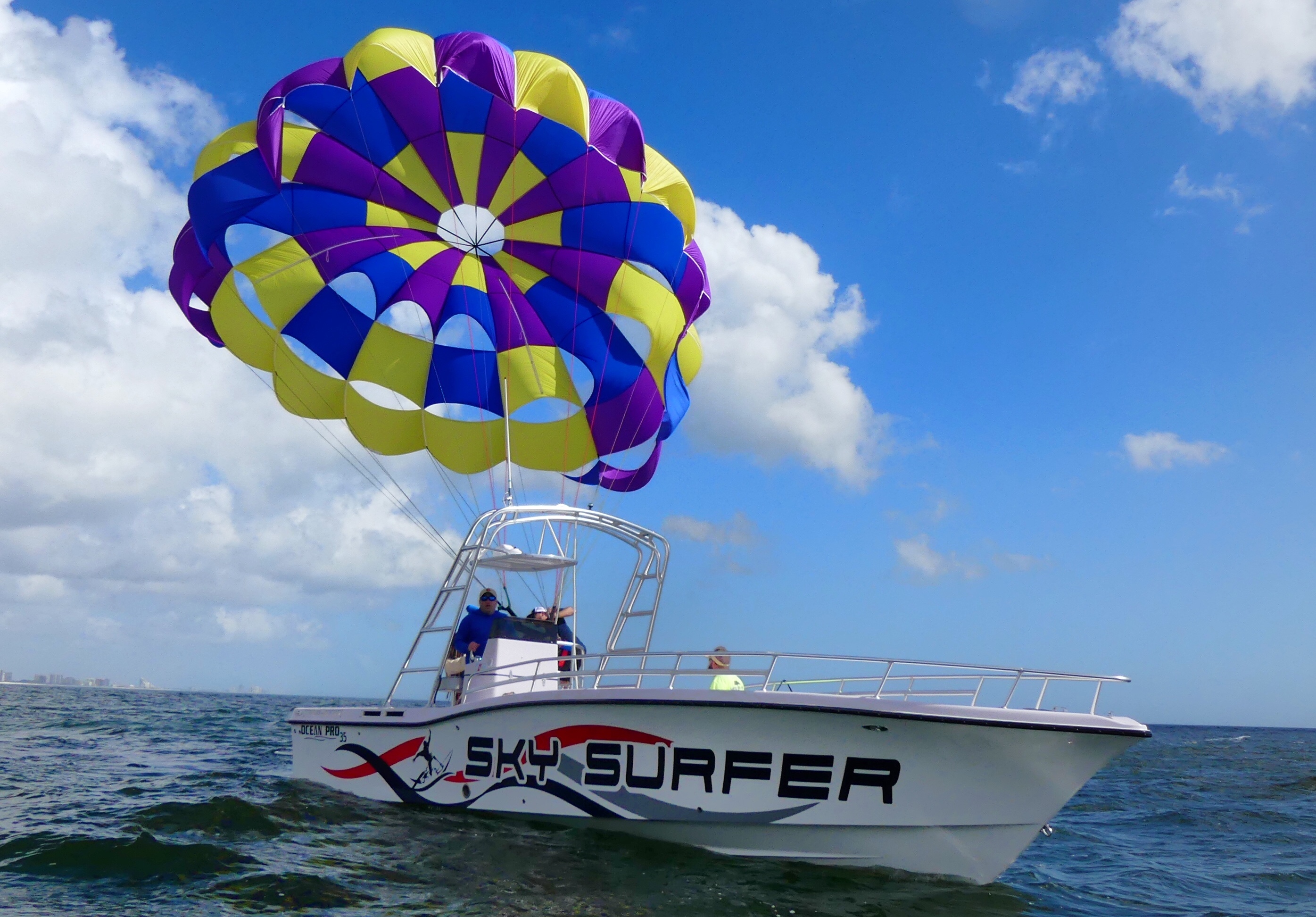 boat carrying a parasail