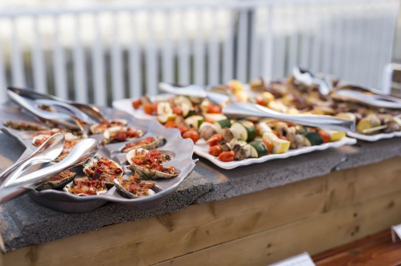 wedding catering featuring platters of hors d'oeuvres on outside table